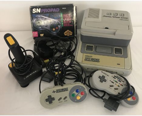 A 1992 SNES Super Nintendo Entertainment System with accessories. Bundle includes: power lead, scart, joy stick, 3 controller