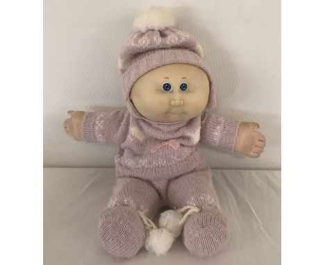 A vintage 1980's Coleco Industries Cabbage Patch Kids baby doll. With original knitted 3 piece outfit and felt nappy. Approx.