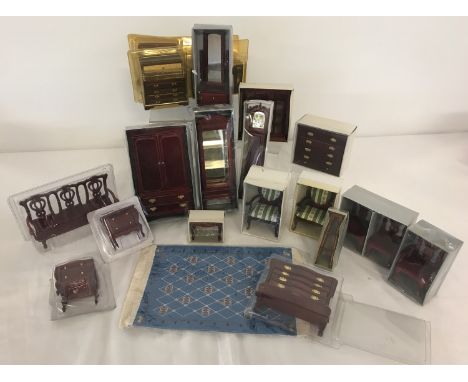 A collection of boxed mahogany coloured wooden dolls house furniture. To include: wardrobe, display cases, Grandfather clock,