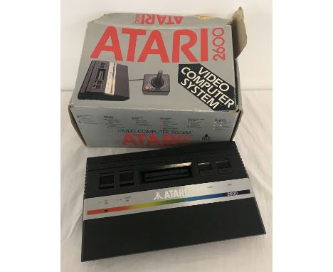 A boxed 1980's Atari 2600 console, no power lead or joy stick.  