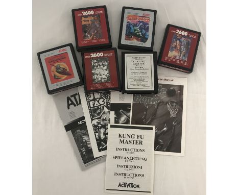 6 1980's Atari 2600 game cartridges; 5 of them with instructions manuals. Comprising: Dark Chambers (no manual), Kung-Fu Mast