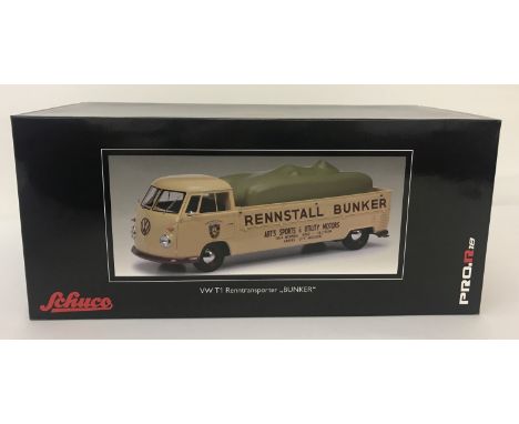 A boxed VW T1 Renntransporter "Bunker" by Schuco. 1:18 scale. In original unopened packaging. With Rennfahrer Art Bunker Pors