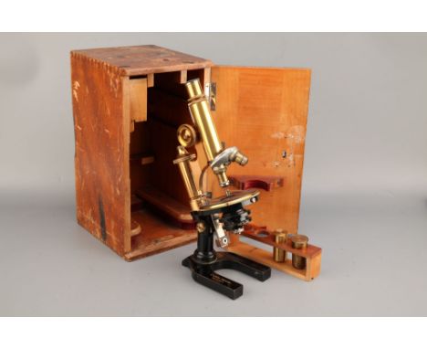 A Leitz Microscope,German, c.1900, signed 'E. Leitz Wetzlar No.152876, finished in black enamel with lacquered brass parts, w