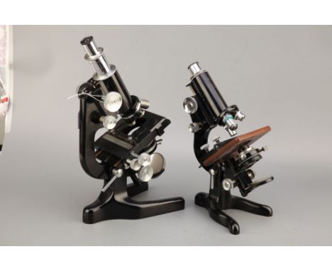 Two Watson Microscopes,including a large Watson dervice microscope finished in black with all nickel parts, with objectives a