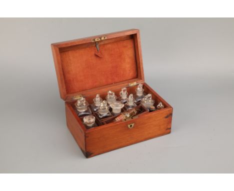 A Small Apothecary Chest, French polished mahogany case, interior with fitted glass bottles, lift out tray to front with hand