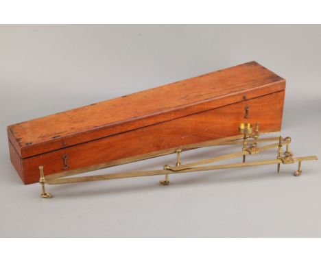 Cased Brass Pantograph,English, C.1850, unsigned on small ivory castors with other acessoris in mahogany case, case length 64