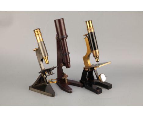 Three Microscopes,including a lacquered brass microscope by Becker &amp; Co, London finished in black enamel with lacquered b