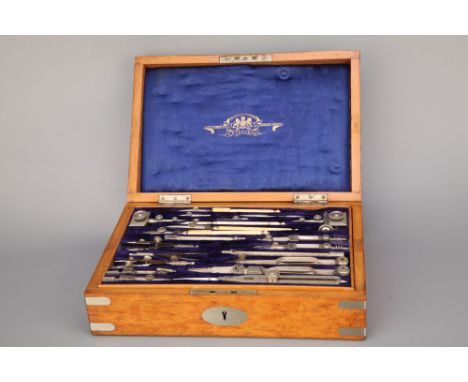 A Good Set of Drawing Instruments by Stanley, in nickel-silver, in nickel-silver bound golden oak case, all instruments origi