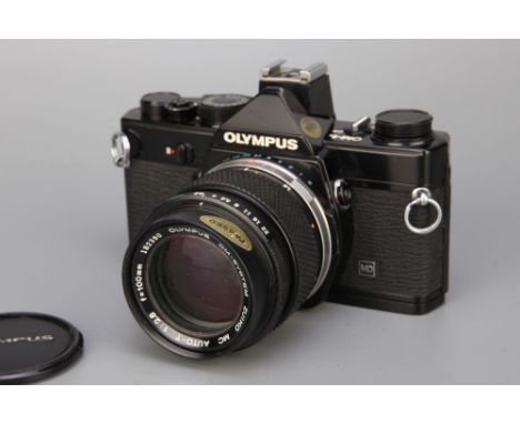 An Olympus OM--1n MD SLR Camera,black, with Zuiko f/2.8 100mm lensCondition Report: Some light internal fungus to lens