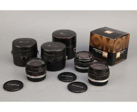 Three Wide Angle Olympus OM Lenses,including G.Zuiko f/3.5 28mm, Zuiko f/2.8 28mm and Zuiko f/2.8 35mm, all in maker's cases 