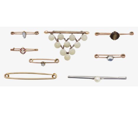 Eight mostly 19th century gem-set and gold brooches including a Victorian articulated satin spar cascade bar brooch, a ruby (