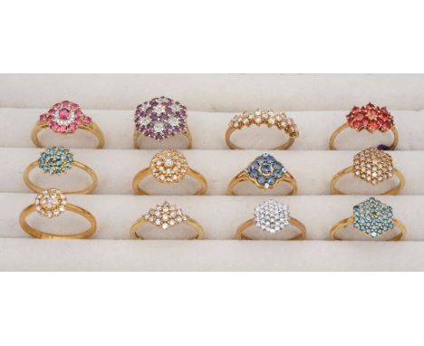 A collection of 9ct fancy diamond cluster ringsfeaturing three hexagon head cluster rings in blue white and champagne diamond