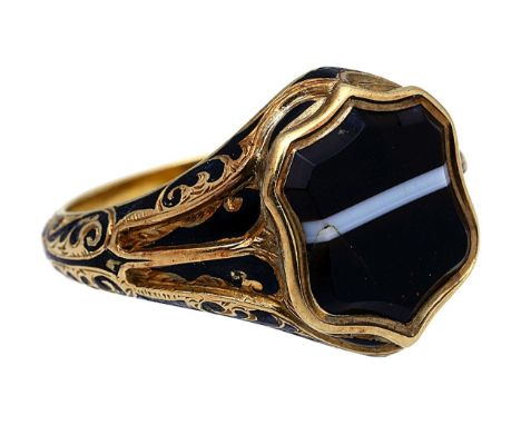 A mid Victorian agate, enamel and yellow gold memorial ringthe central banded agate escutcheon-shaped shield to the elaborate