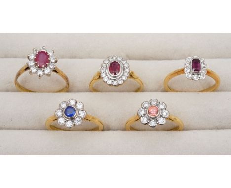 A set of 18ct diamond cluster rings,with a 18ct hallmark, 0.50ct stamp, ruby oval diamond claw set cluster ring, a 18ct hallm