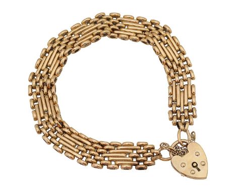 A 15ct gold fancy link five bar gate bracelet with 15ct stamp to ring, textured and polished links safety chain with 9ct hall