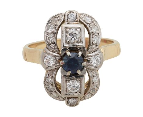 A diamond and gem stone rectangle dress ringfeaturing a diamond cross claw set centrally with a blue mixed cut gem stone to a