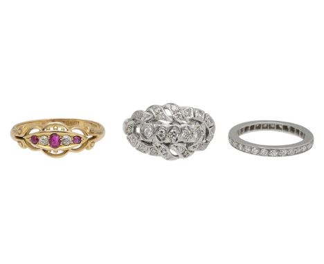A 18ct Edwardian ruby ring, diamond eternity and dress ringwith 18ct hallmark, featuring old cut ruby oval centre with old cu