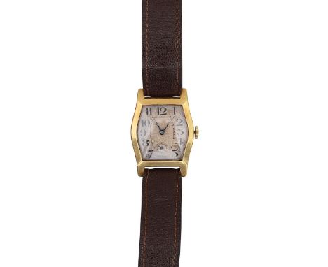 An 18ct gold manual wind wristwatchof shaped tonneau form with silvered dial, Arabic numerals and subsidiary dial, the case s