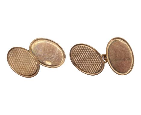 A pair of 9ct oval cufflinkswith engine turn detailing and 9ct hallmark to reverse. total approx. weight 8.7g Condition: Good