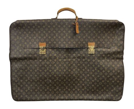 A large bespoke Louis Vuitton folio casewith classic LV monogram, gold tooled hardware, to clasps to front and leather carryi