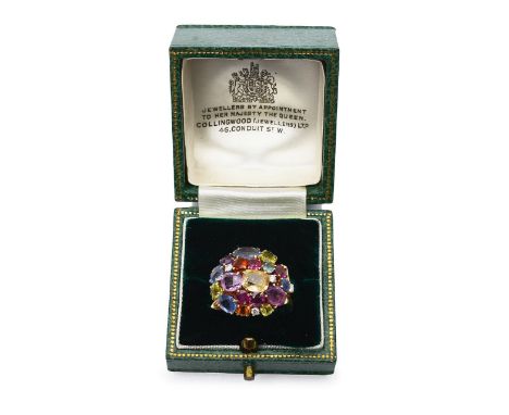 A 1960s 18ct gold fancy cocktail ring with diamond and multi gem stonescomprising various shaped gem stones including sapphir