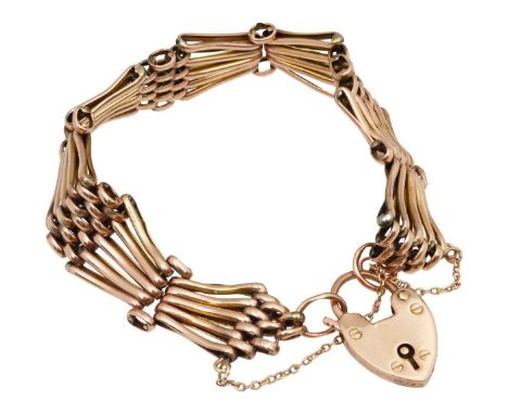 A 9ct rose five bar gate braceletwith 9ct stamp to heart shape catch and back of bar link, with long and short bar links,tota