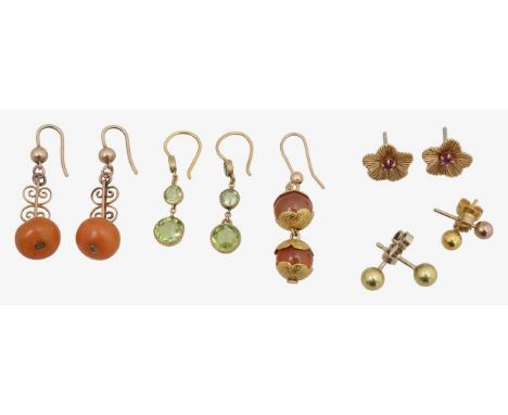 A collection of amber, peridot, ruby and cornelian earringscomprising of a pair of amber drops with open wire work and shephe