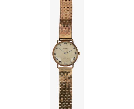 A 9ct gold gentleman's Accurist manual wind bracelet watch the silvered dial with Roman numerals, blued hands, articulated br