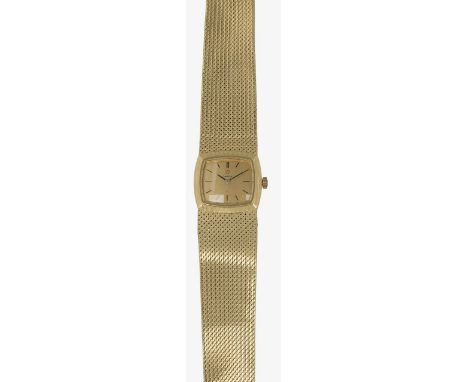 An 18ct gold Omega lady's bracelet manual wind wristwatch the square gold coloured dial with baton numerals, with textured li