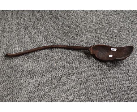 A large African ethnic carved spoon or ladle, measuring 85cm long