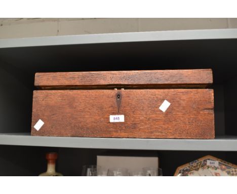A vintage oak writing desk, in need of restoration, containing a selection of assorted celebration cards.
