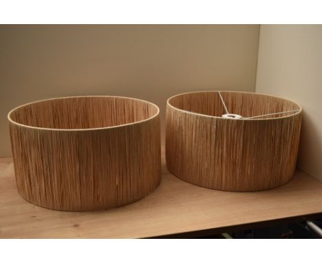 A pair of natural raffia ceiling lamp shades 40cm diameter x 20cm depth.