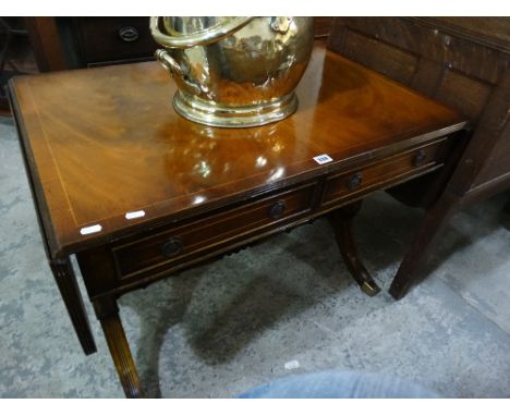 A Reproduction Sofa Table On Brass Castors