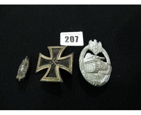 An Iron Cross First Class With Pin Back Together With A Small RAD Badge And Reproduction Tank Assault Badge