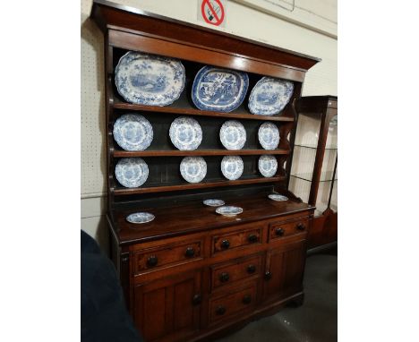 A 19th Century Anglesey Oak And Mahogany Dresser Having A Three Shelf Rack And A Base Of Cupboards And Drawers 62 Inches Wide