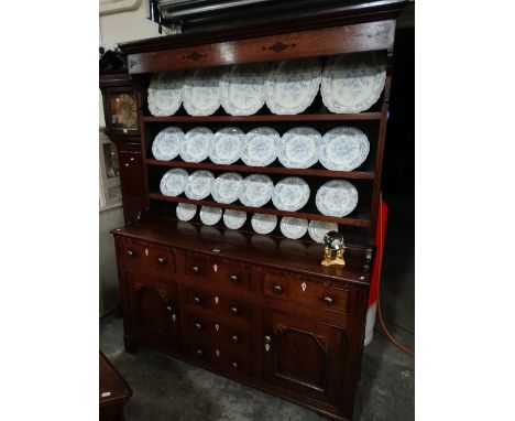 A 19th Century Oak Anglesey Dresser With Diamond And Dot Motifs (Talwrn) Having A Three Shelf Rack The Base Having An Arrange