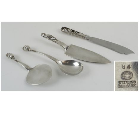 G. JENSEN STERLING SILVER, fish slice, cake slice and serving spoon, all with blossom pattern terminals. (4)