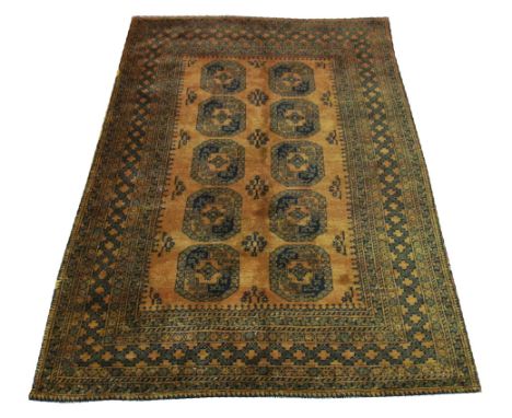 GOLD AFGHAN CARPET, 240cm x 163cm, repeat tribal gul decoration inside multiple geometric bands and borders.