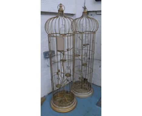 BIRD CAGE TEA LIGHT HOLDERS, a pair, in gilded metal finish with five holders suspended from branch, 112cm H. (2) with faults