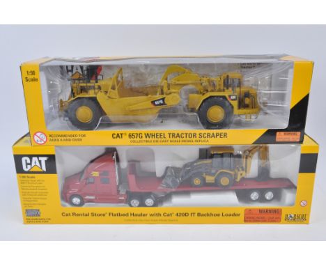 Norscot 1:50 scale CAT 657G Wheel Tractor Scraper plus CAT Rental Flatbed Hauler with CAT Backhoe Load. NM-M in E Boxes. (2)