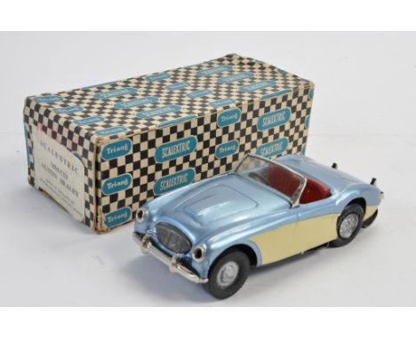 Rare Scalextric MM/C53 Austin Healey (tinplate) in blue/cream with silver wheel. Has been maintained and vendor states is a r