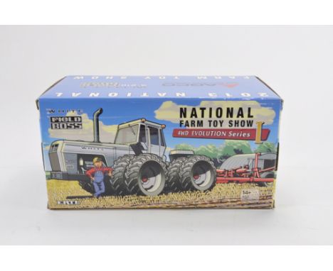 Ertl 1:32 scale Toy Farmer NFTS White Field Boss Tractor. NM-M in E Box.