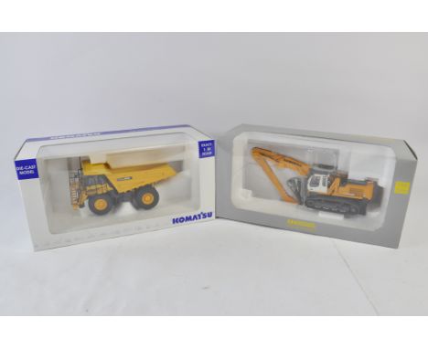 Universal Hobbies 1:50 Komatsu HD605 Mine Truck plus Liebherr R944 Material Handler. Both NM-M in E Boxes. (2)