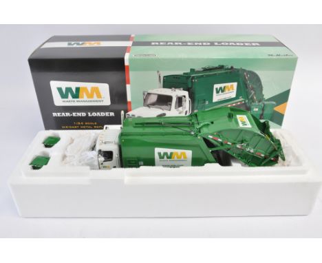 First Gear 1:34 scale Mack Waste Management Rear Load Refuse Truck. NM-M in E Box.