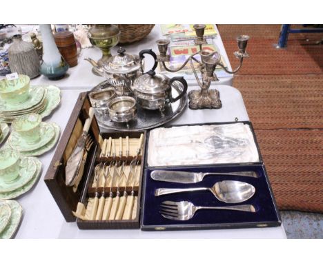 A QUANTITY OF SILVER PLATE TO INCLUDE A TRAY, TEAPOTS, CREAM JUG, SUGAR BOWL AND CANDLEABRA PLUS A QUANTITY OF BOXED FLATWARE