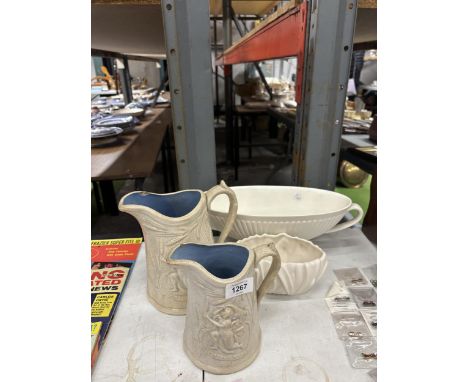 FOUR ITEMS OF POTTERY TO INCLUDE A LARGE WEDGWOOD PLANTER, SYLVAS PLANTER AND TWO STONEWARE JUGS
