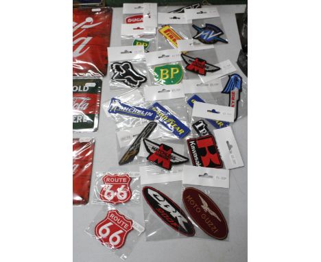 TWENTY MOTORING THEMED SEW ON BADGES TO INCLUDE MICHELIN, GOOD YEAR, BP, TRIUMPH, ETC - NEW IN PACKAGING