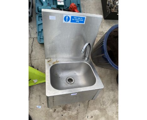 AN INDUSTRIAL STAINLESS STEEL KNEE PUSH SINK UNIT