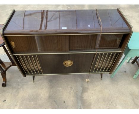 AN ARKANSAS STEREO RADIOGRAM WITH PULL OUT GARRARD DECK, BLAUPUNKT RADIO AND CENTRAL TWO DOOR STORAGE CUPBOARD, 45" WIDE