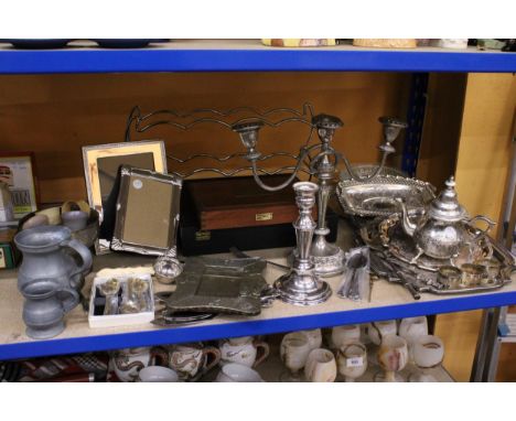A LARGE QUANTITY OF SILVER PLATED ITEMS TO INCLUDE FLATWARE, PHOTO FRAMES, CANDLESTICKS, TRAYS, CUTLERY BOXES, ETC